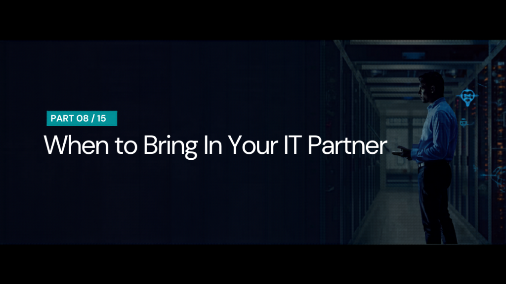 IT professional with a laptop in a server room